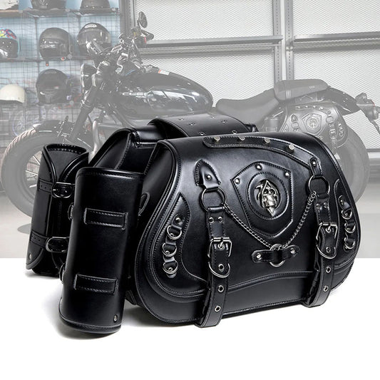 A black Steampunk Skull Motorcycle Bag with skull rivets and chains displayed in front of a motorcycle.