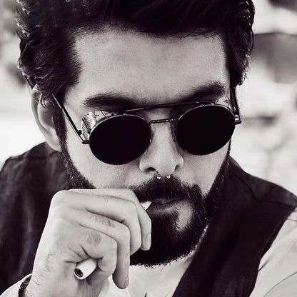 Man wearing sunglasses with a blurred background